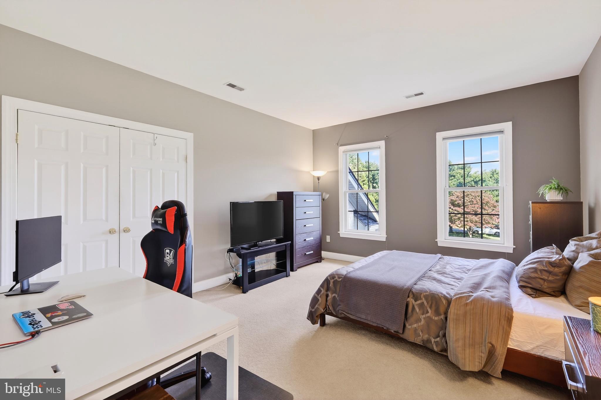 7221 Preservation Court Fulton, MD 20759 - Photo 35 of 69 a bedroom with a bed and a flat screen tv