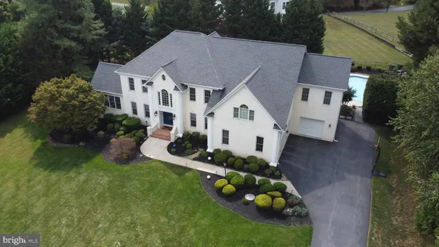 a view of a dining room with furniture wooden floor and chandelier