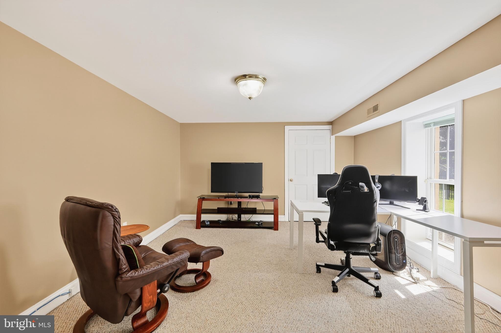 7221 Preservation Court Fulton, MD 20759 - Photo 47 of 69 a view of a workspace with furniture and a window