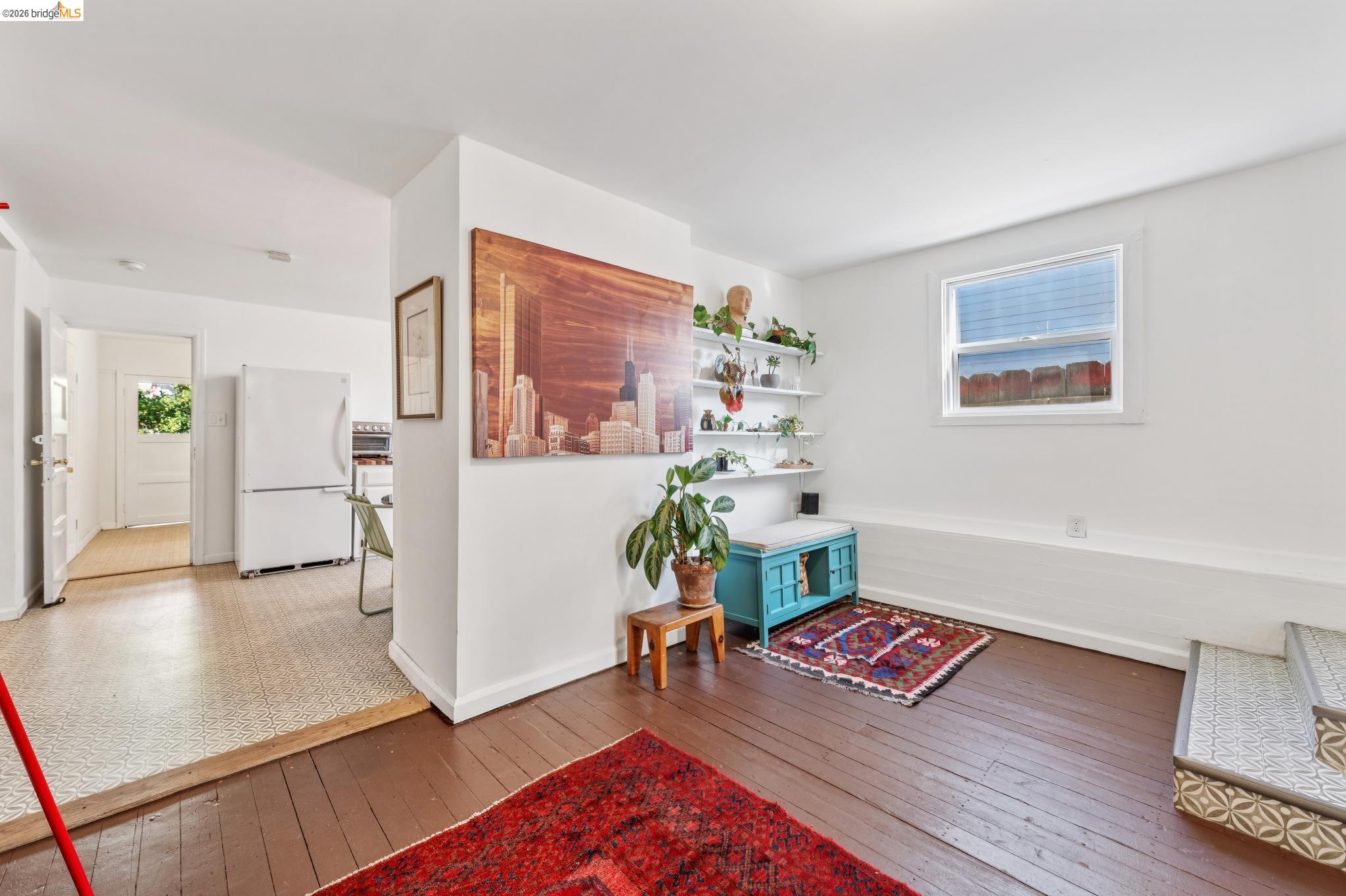 836 20th Street Oakland, CA 94607 - Photo 22 of 54 a living room with furniture and a wooden floor