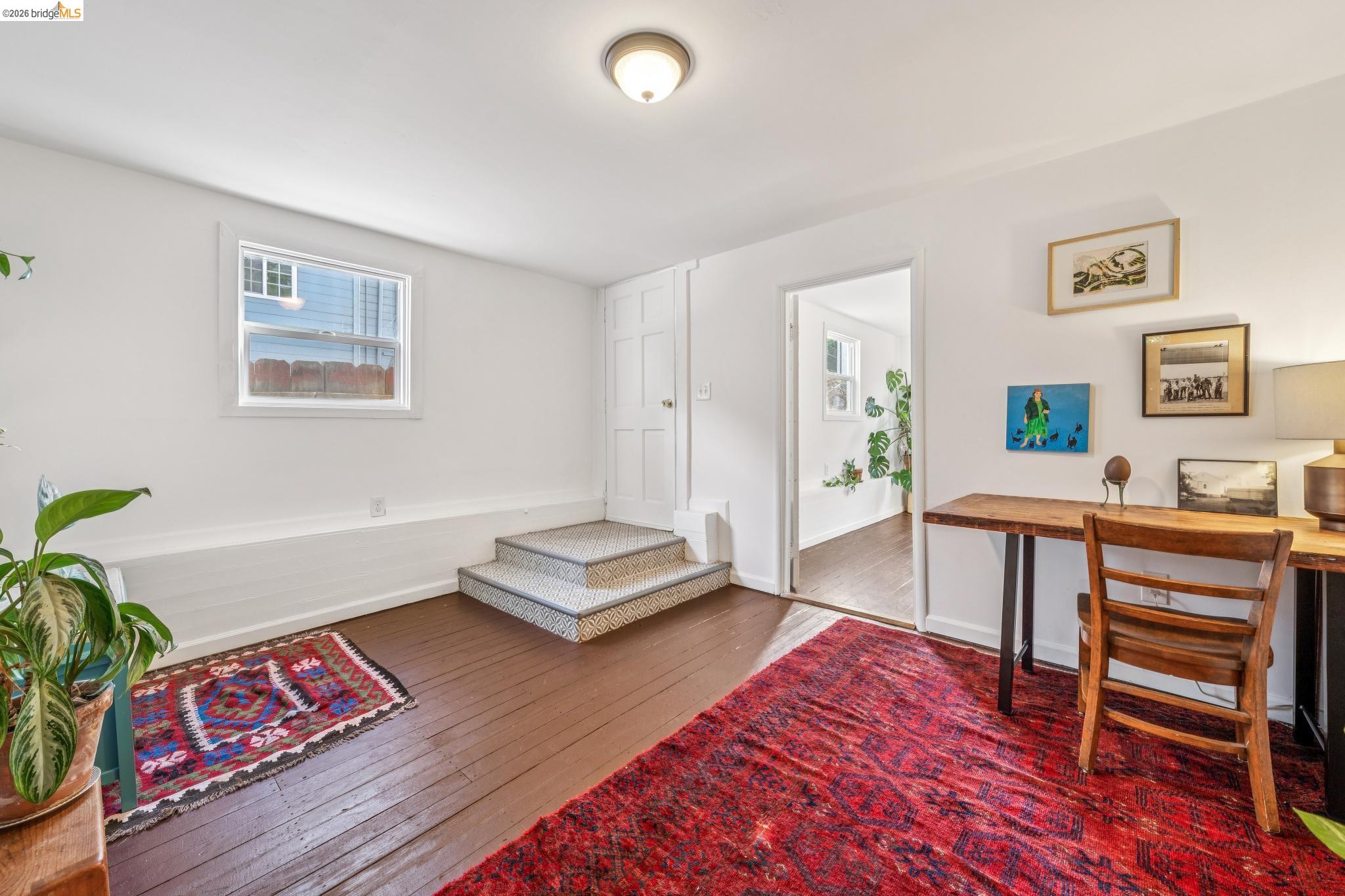 836 20th Street Oakland, CA 94607 - Photo 24 of 54 a living room with furniture and a wooden floor