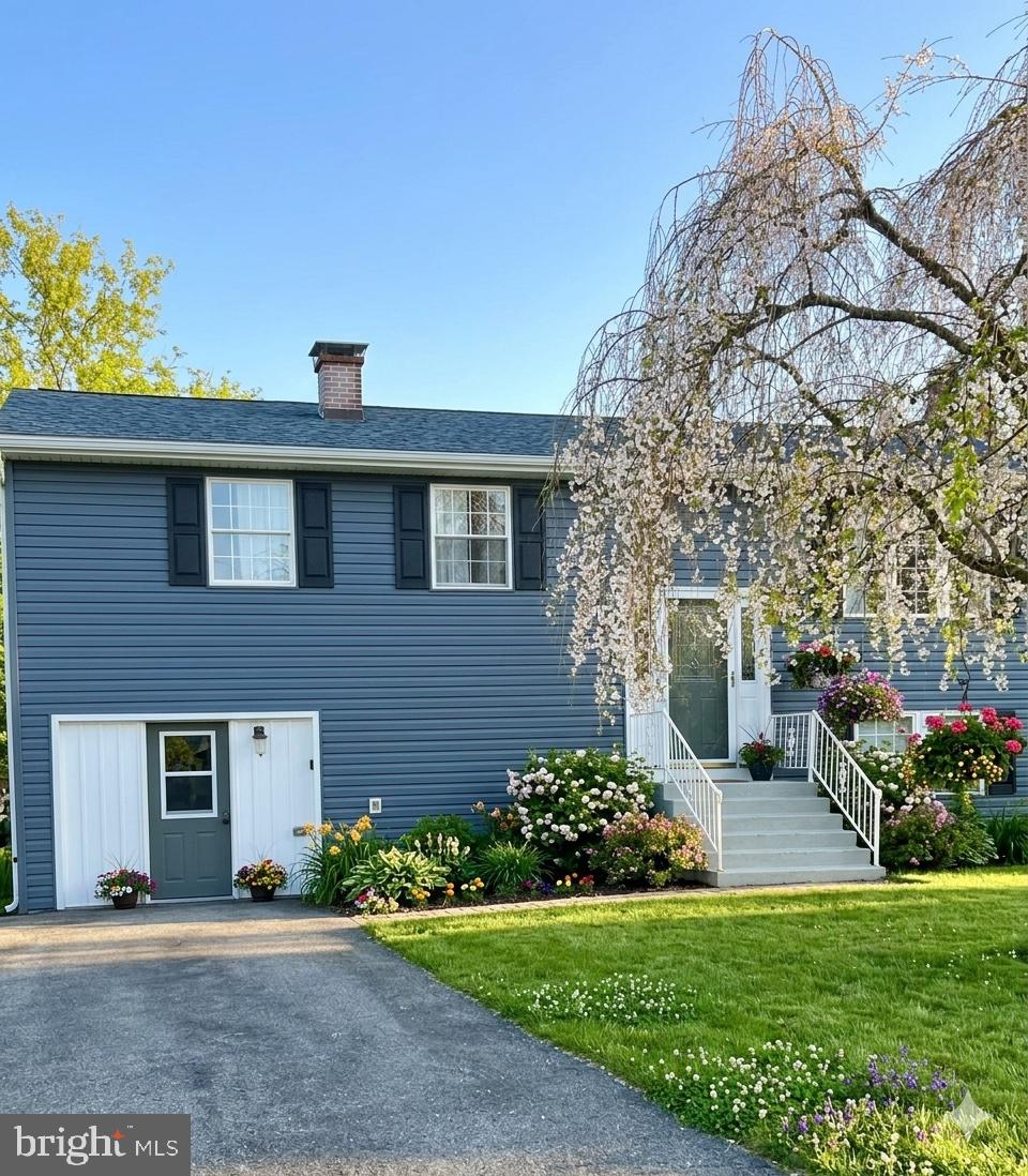 10 Sherman Street Hanover, PA 17331 - Photo 1 of 1 a front view of a house with a yard and garage