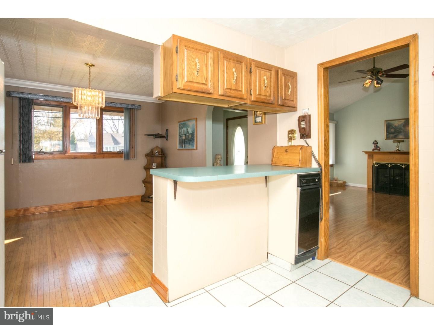 34 South Bell Road Bellmawr, NJ 08031 - Photo 15 of 25 a view of a kitchen with furniture and a wooden floor