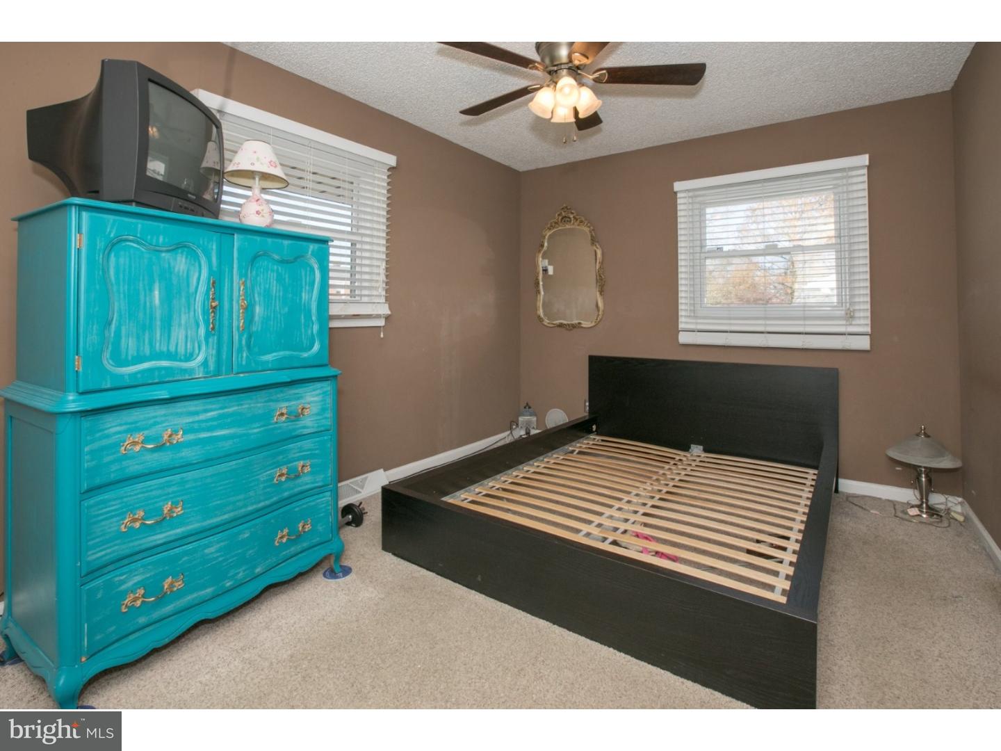 34 South Bell Road Bellmawr, NJ 08031 - Photo 18 of 25 a bedroom with a bed and a window