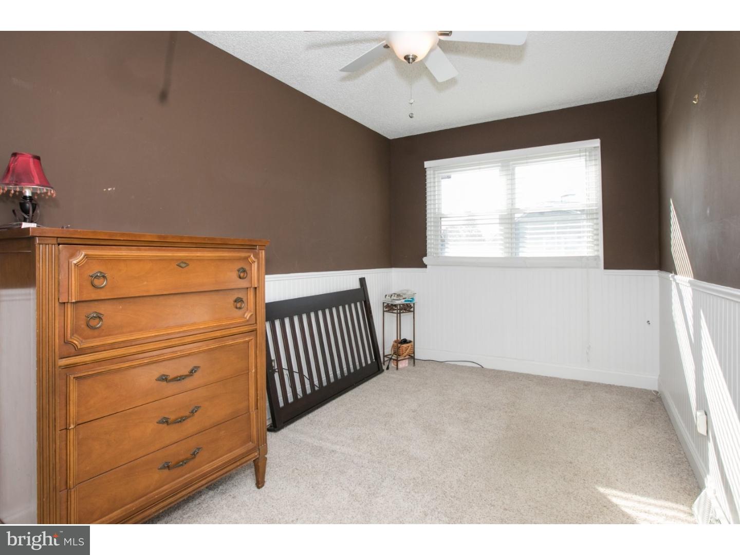 34 South Bell Road Bellmawr, NJ 08031 - Photo 21 of 25 a view of a livingroom with a dresser