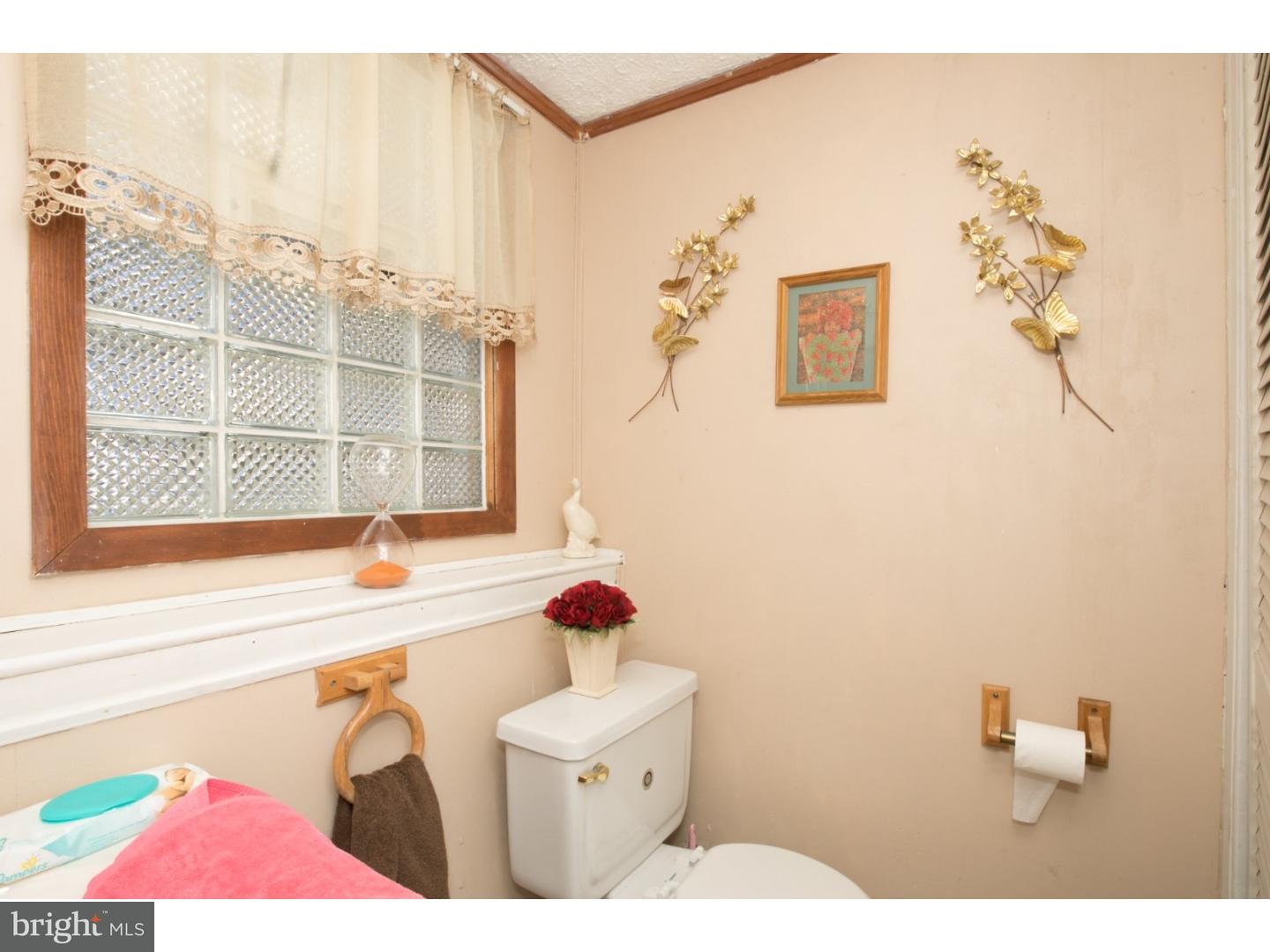 34 South Bell Road Bellmawr, NJ 08031 - Photo 23 of 25 a bathroom with a sink mirror and a bathtub