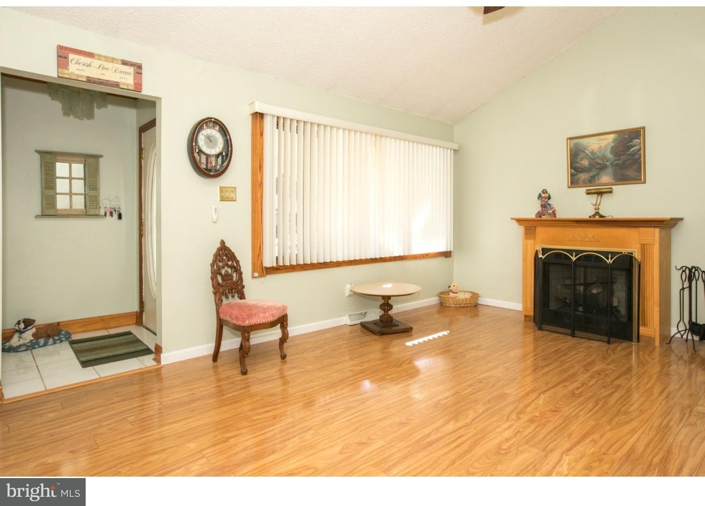 34 South Bell Road Bellmawr, NJ 08031 - Photo 4 of 25 a living room with furniture and a fireplace