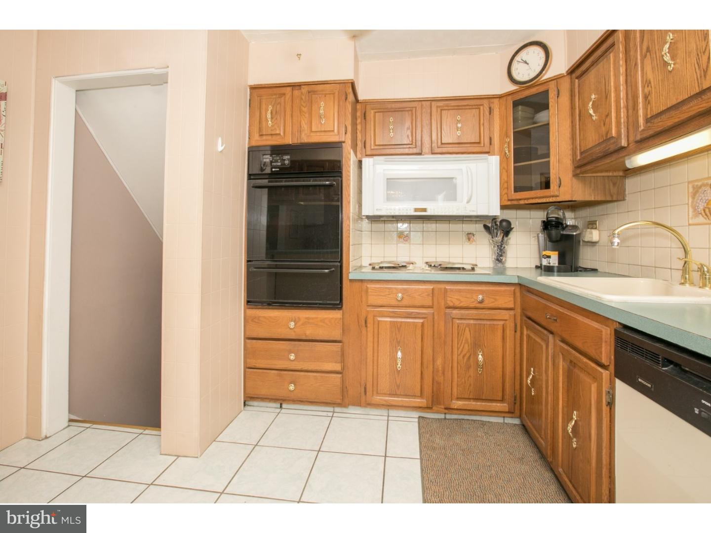 34 South Bell Road Bellmawr, NJ 08031 - Photo 6 of 25 a kitchen with a refrigerator sink and cabinets