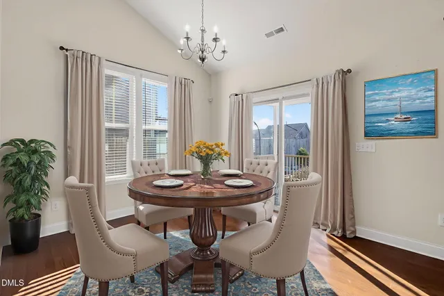 a view of a livingroom with wooden floor and a window