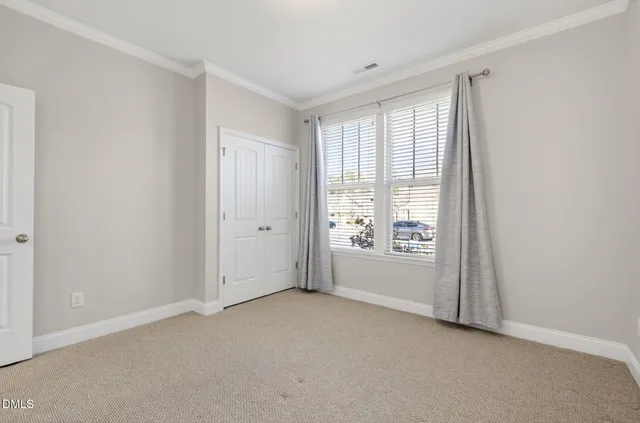 a view of a house with a yard and garage