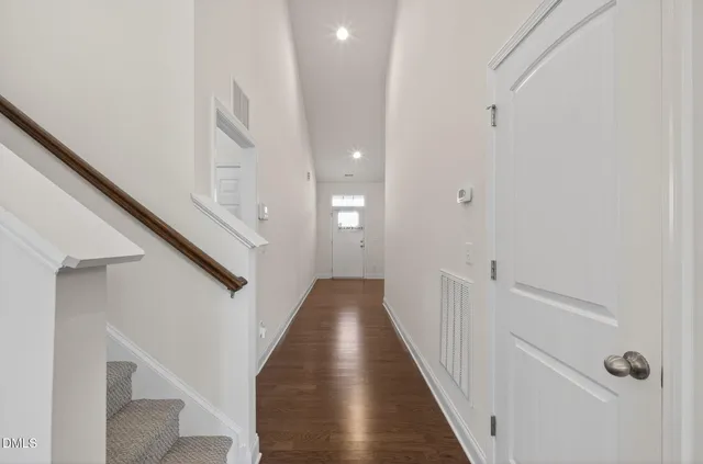 a kitchen with stainless steel appliances granite countertop a sink refrigerator and cabinets