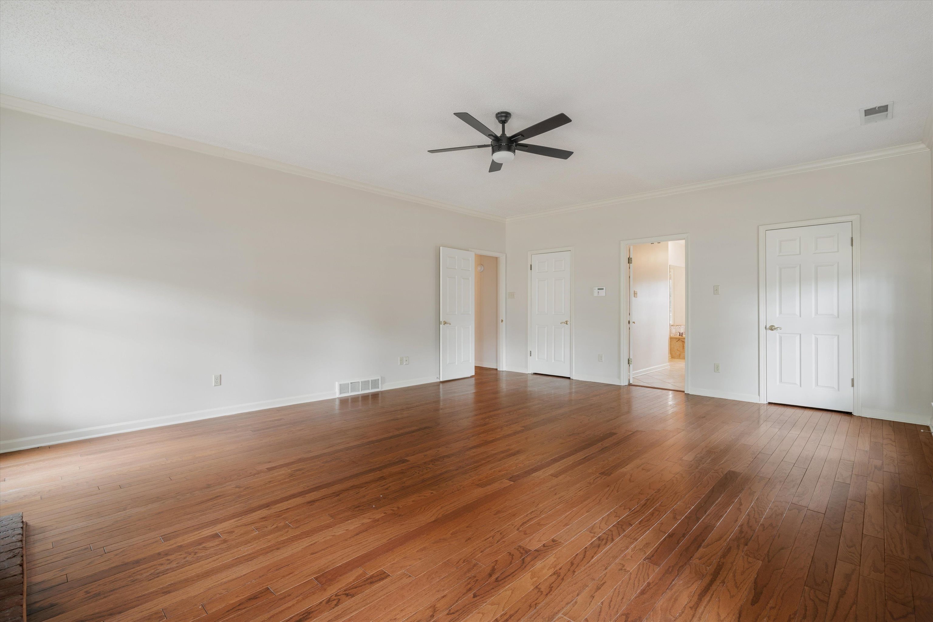 4309 Garner Place Bartlett, TN 38135 - Photo 14 of 40 an empty room with wooden floor and windows