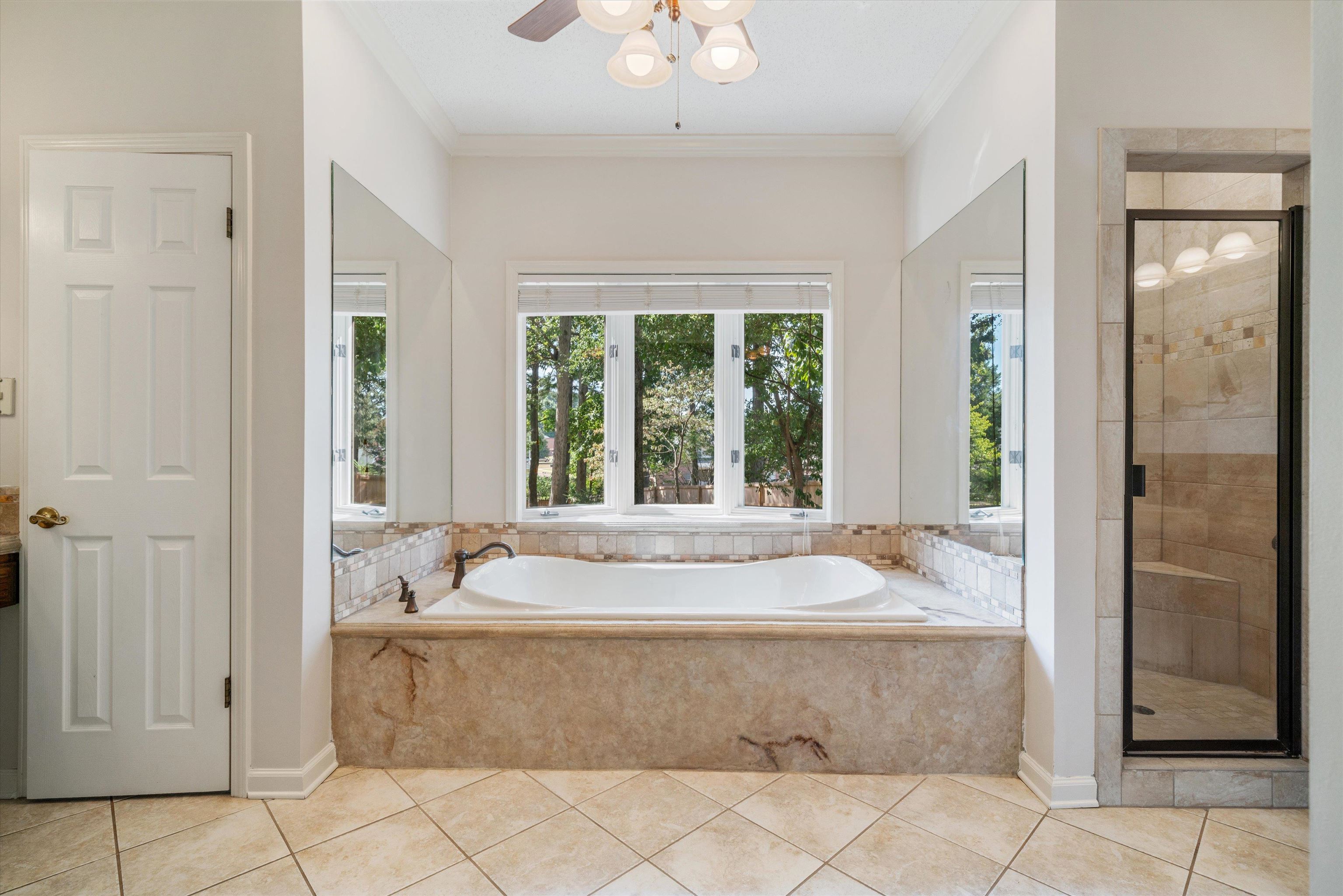 4309 Garner Place Bartlett, TN 38135 - Photo 17 of 40 a bath tub sitting in a bathroom next to a window