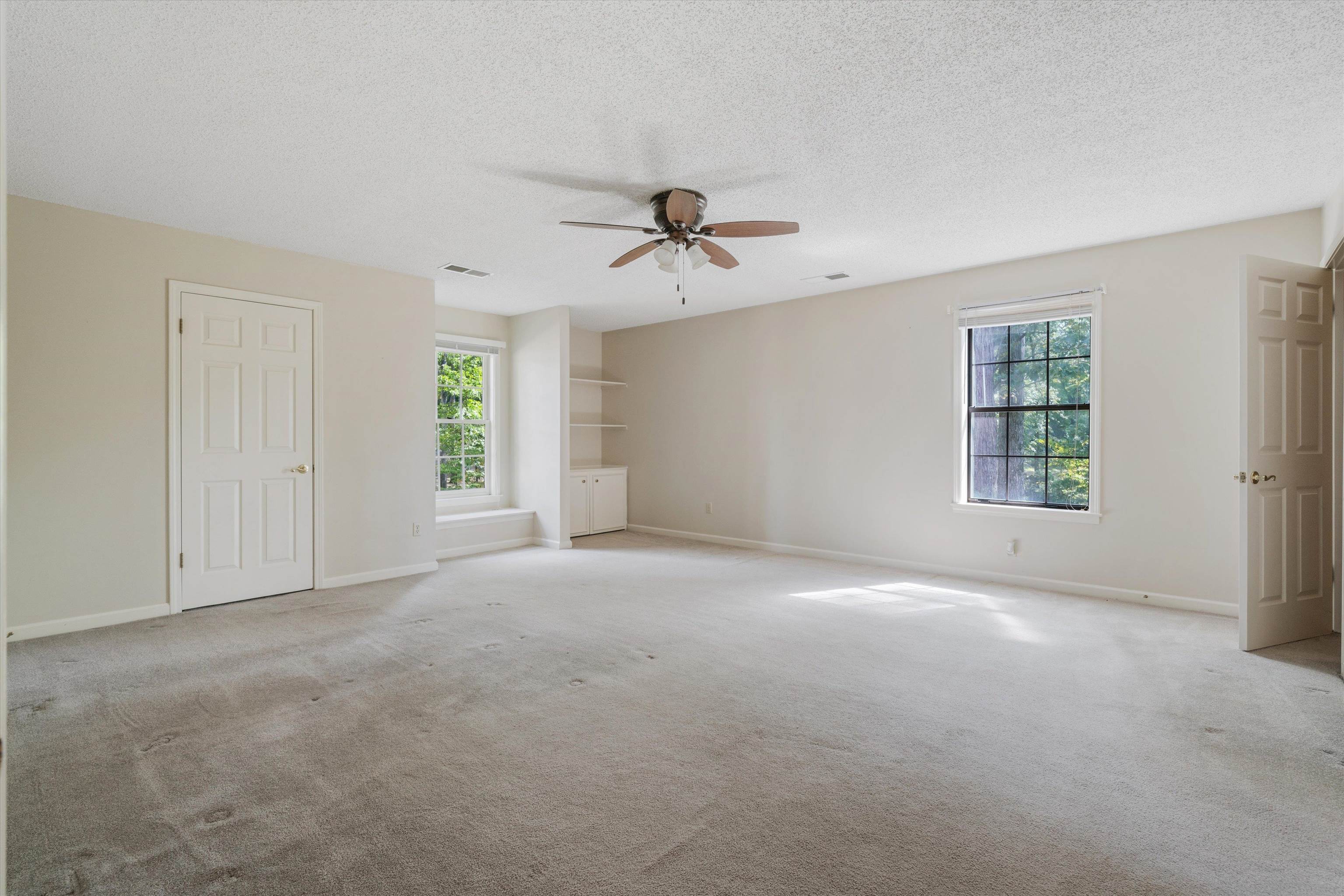 4309 Garner Place Bartlett, TN 38135 - Photo 18 of 40 a view of a room with windows and chandelier fan
