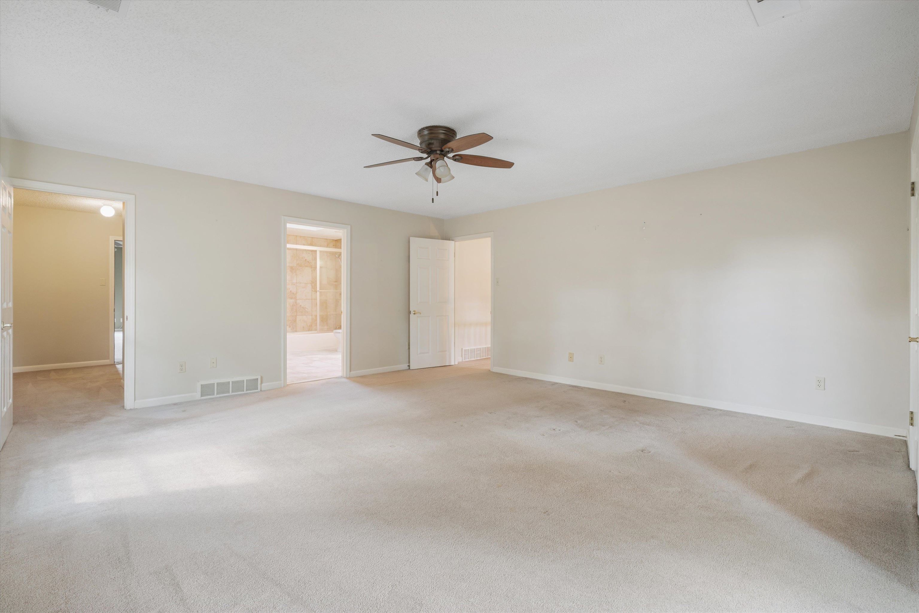 4309 Garner Place Bartlett, TN 38135 - Photo 19 of 40 a view of an empty room with a chandelier fan