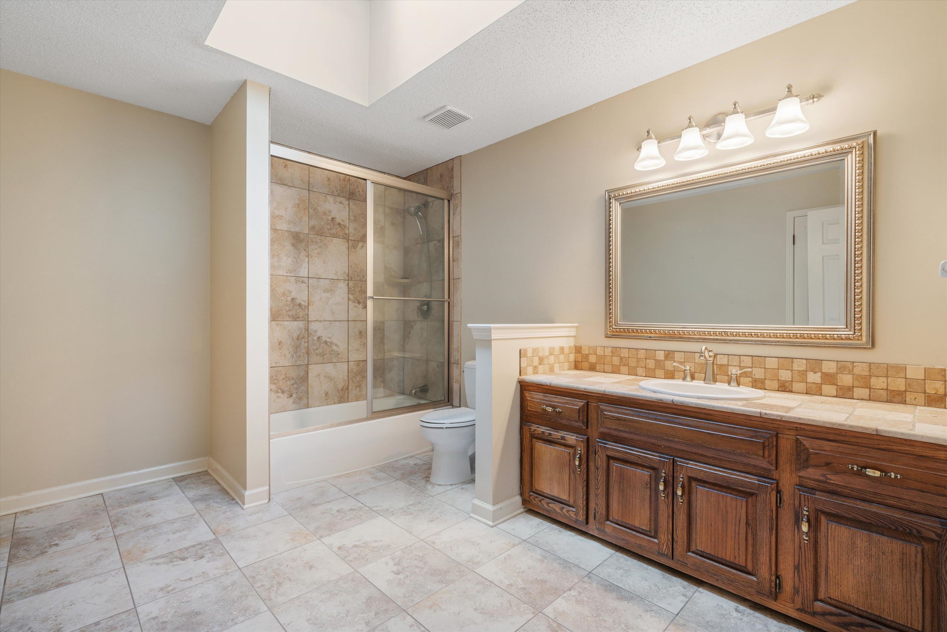 4309 Garner Place Bartlett, TN 38135 - Photo 20 of 40 a spacious bathroom with a tub sink and mirror