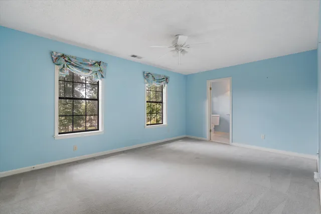 a view of an empty room with windows