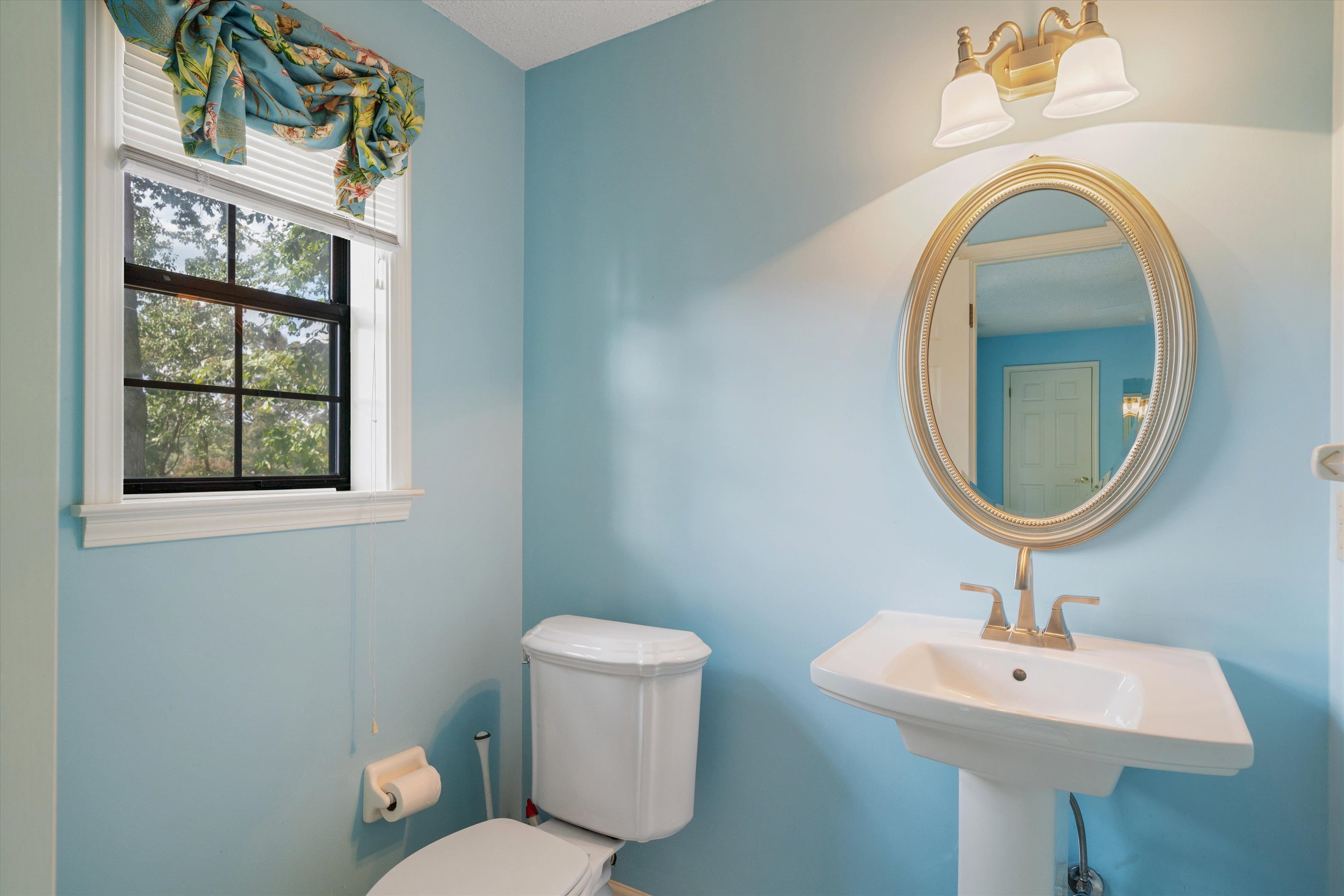 4309 Garner Place Bartlett, TN 38135 - Photo 22 of 40 a bathroom with a toilet sink and mirror