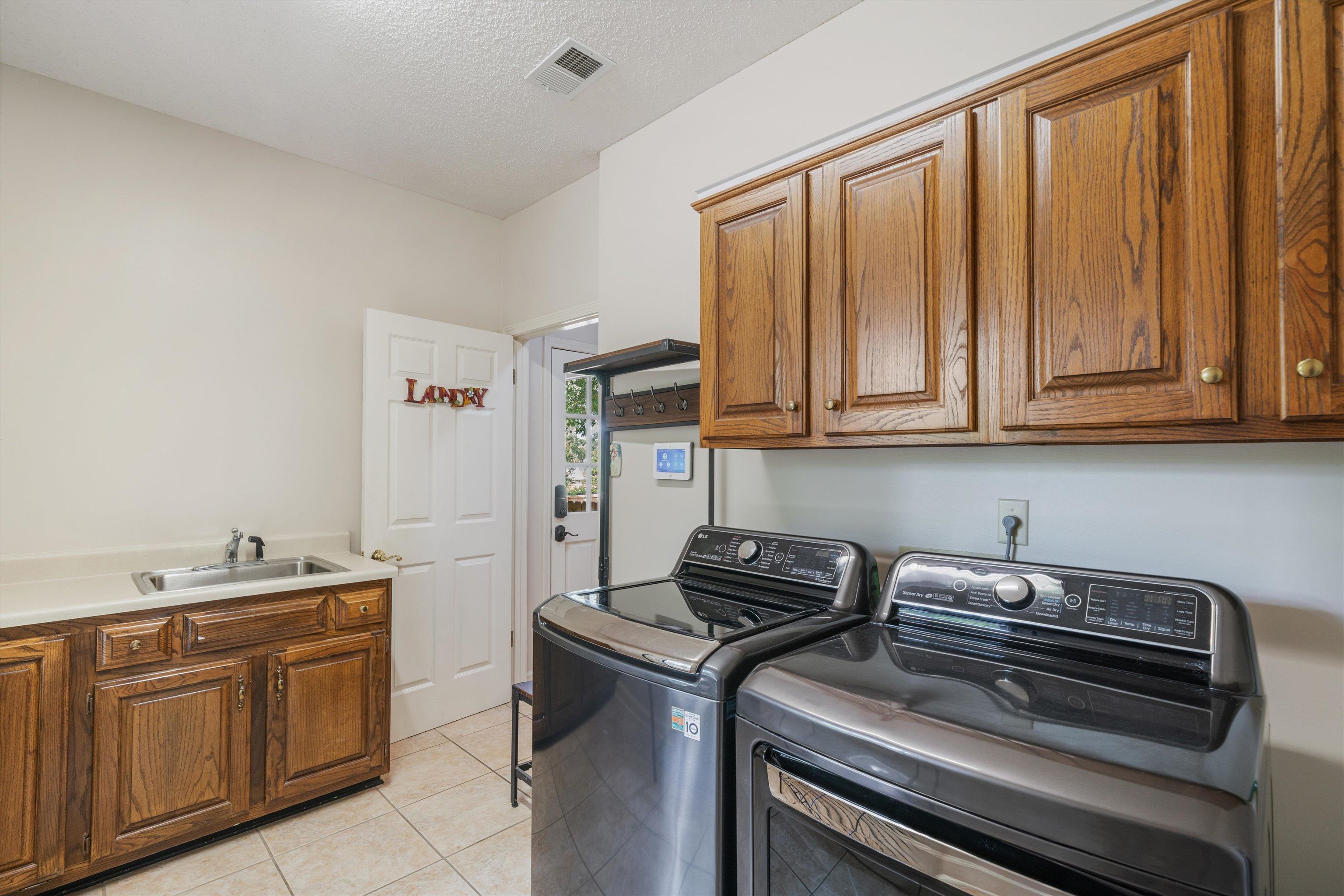 4309 Garner Place Bartlett, TN 38135 - Photo 27 of 40 a kitchen with stainless steel appliances granite countertop a stove a sink and dishwasher