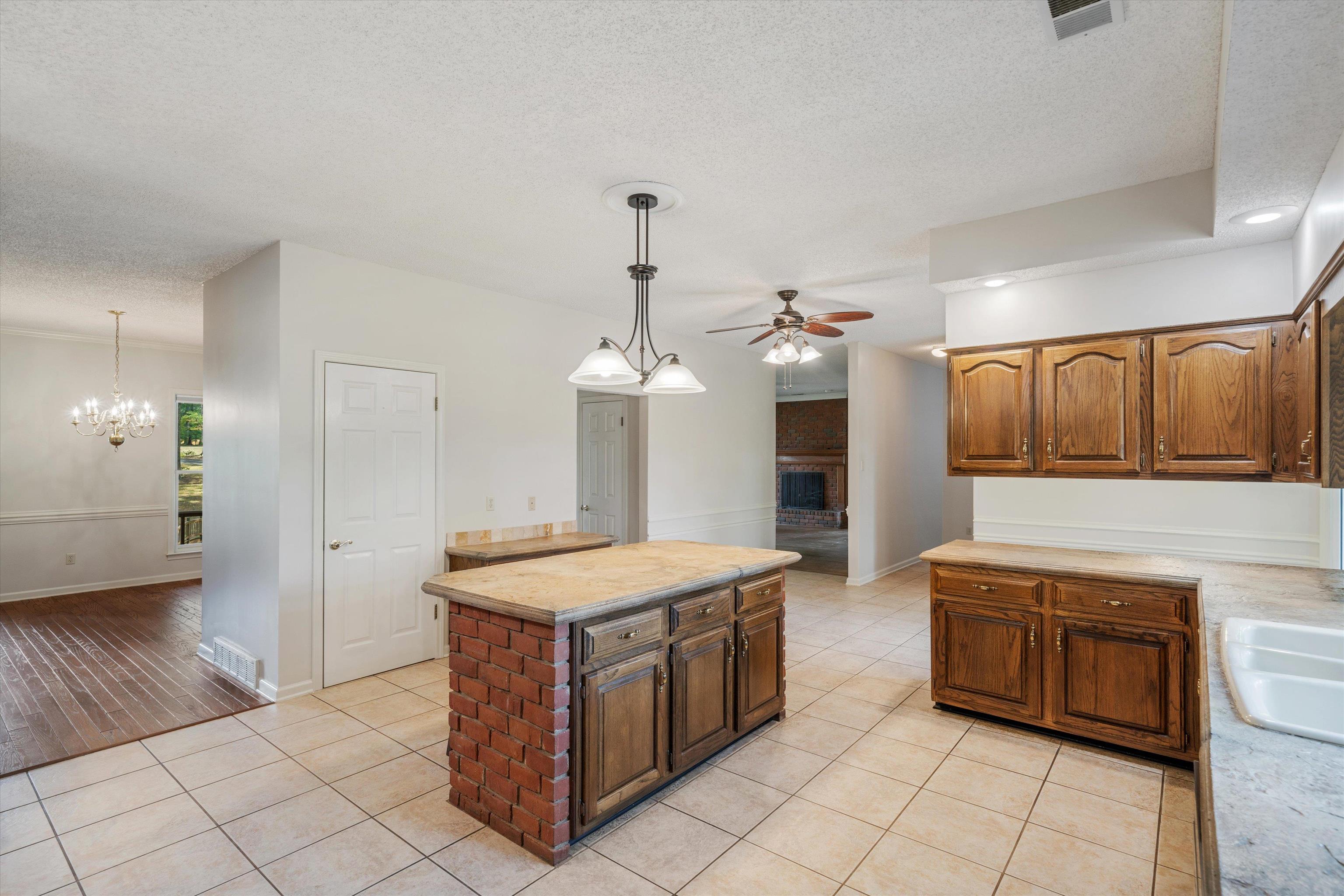 4309 Garner Place Bartlett, TN 38135 - Photo 4 of 40 a kitchen with a stove top oven and cabinets