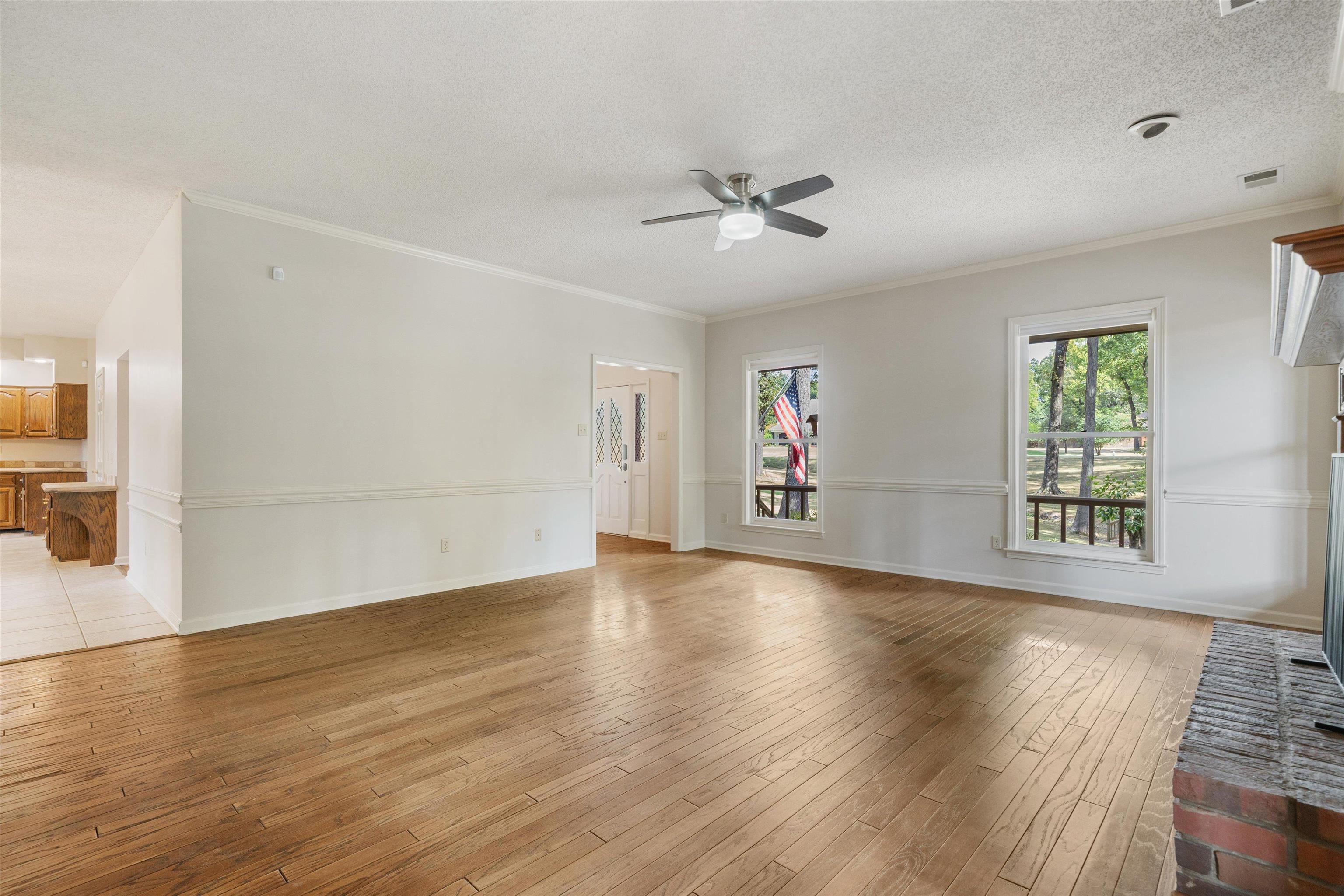 4309 Garner Place Bartlett, TN 38135 - Photo 9 of 40 a view of an empty room with wooden floor and a window