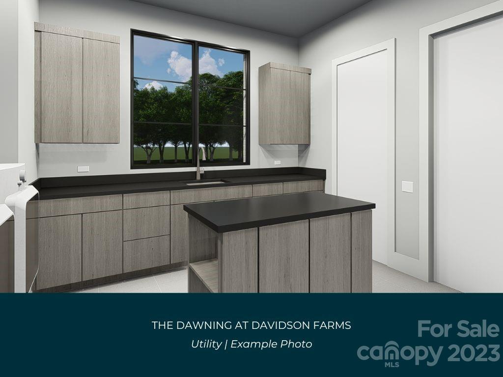 21119 Vandrake Circle, Unit 7 Davidson, NC 28036 - Photo 20 of 33 a kitchen with a sink and a large window