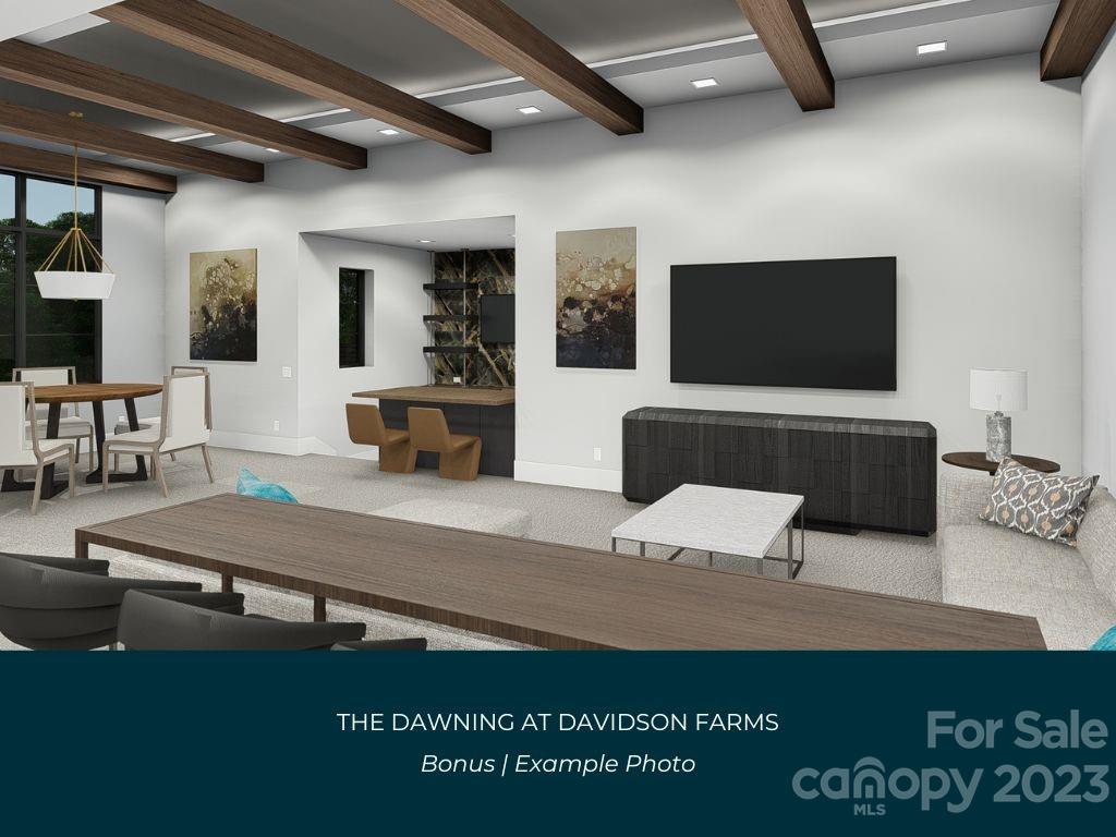 21119 Vandrake Circle, Unit 7 Davidson, NC 28036 - Photo 23 of 33 a living room with furniture and a flat screen tv