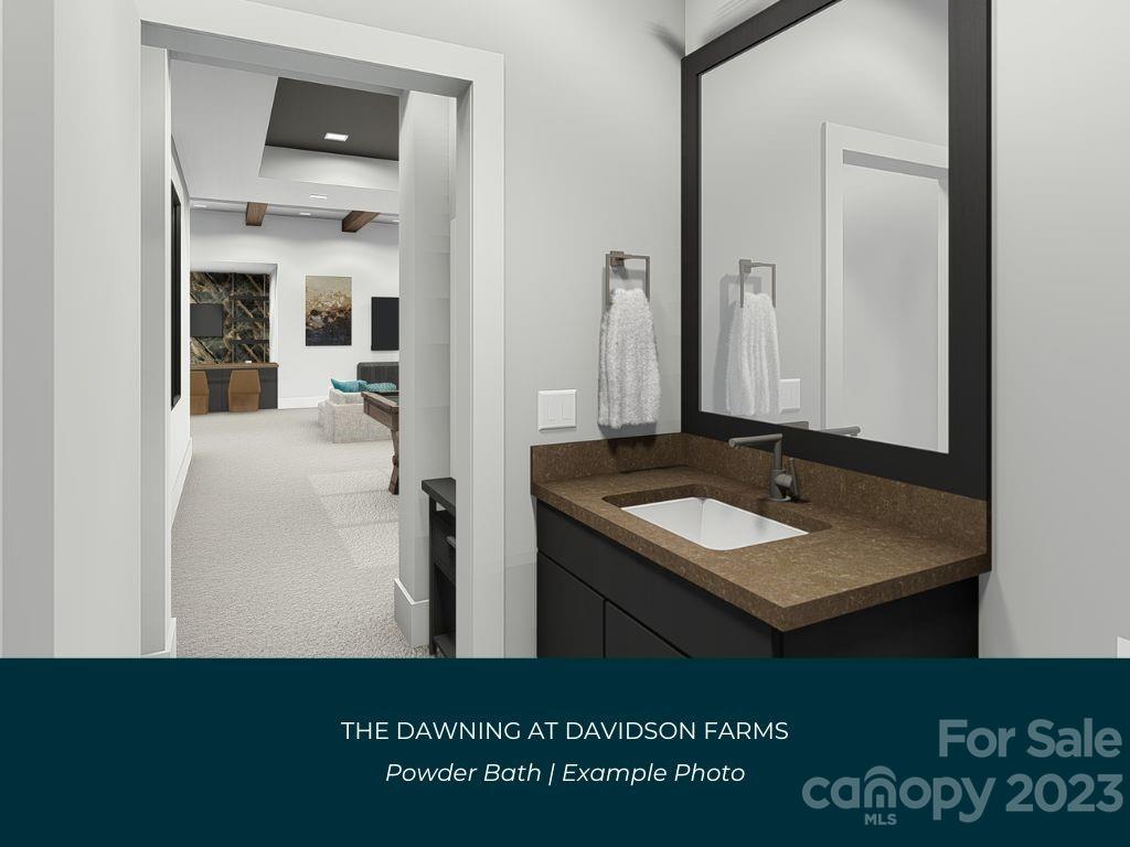 21119 Vandrake Circle, Unit 7 Davidson, NC 28036 - Photo 24 of 33 a bathroom with a sink and a mirror