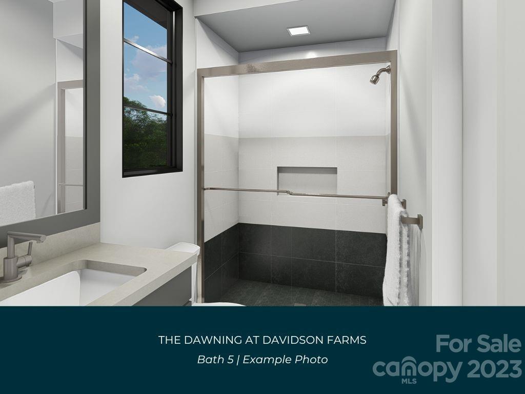 21119 Vandrake Circle, Unit 7 Davidson, NC 28036 - Photo 30 of 33 a bathroom with a sink a mirror and a shower