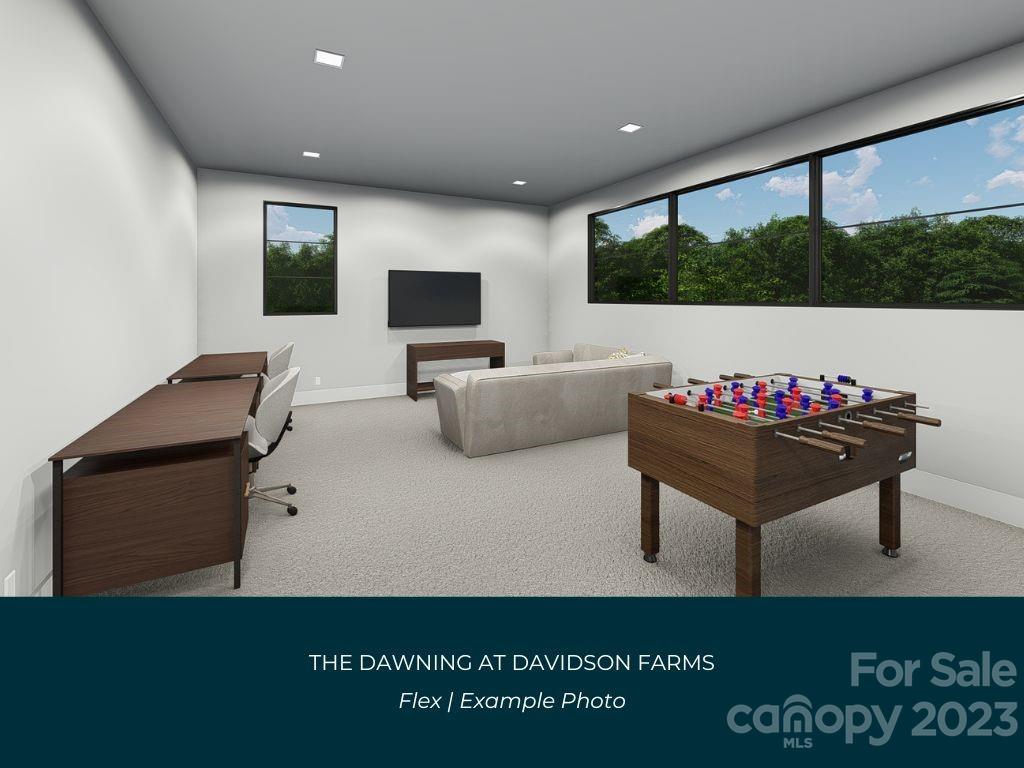 21119 Vandrake Circle, Unit 7 Davidson, NC 28036 - Photo 31 of 33 a living room with furniture and a flat screen tv