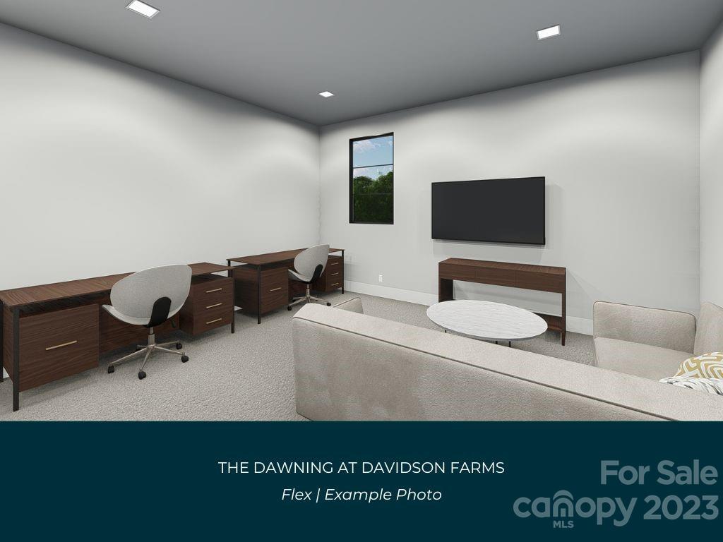 21119 Vandrake Circle, Unit 7 Davidson, NC 28036 - Photo 32 of 33 a living room with furniture and a flat screen tv