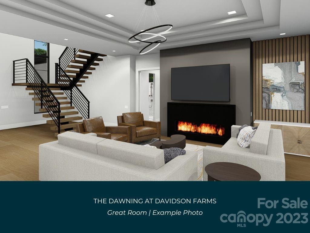 21119 Vandrake Circle, Unit 7 Davidson, NC 28036 - Photo 6 of 33 a living room with furniture a fireplace and a flat screen tv