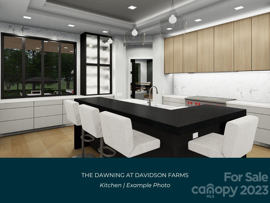 21119 Vandrake Circle, Unit 7 Davidson, NC 28036 - Photo 7 of 33 a kitchen with a table chairs sink and cabinets