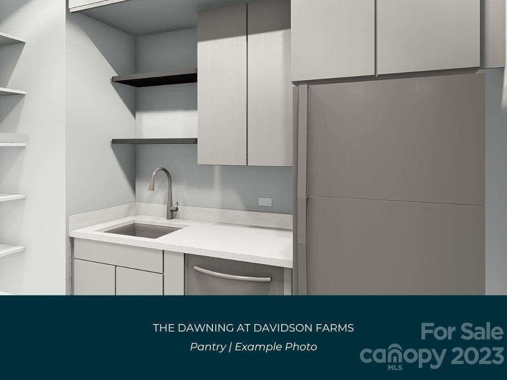 21119 Vandrake Circle, Unit 7 Davidson, NC 28036 - Photo 9 of 33 a kitchen with a sink and a refrigerator