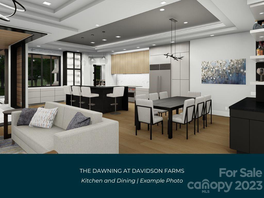 21119 Vandrake Circle, Unit 7 Davidson, NC 28036 - Photo 10 of 33 a living room with furniture and a large window