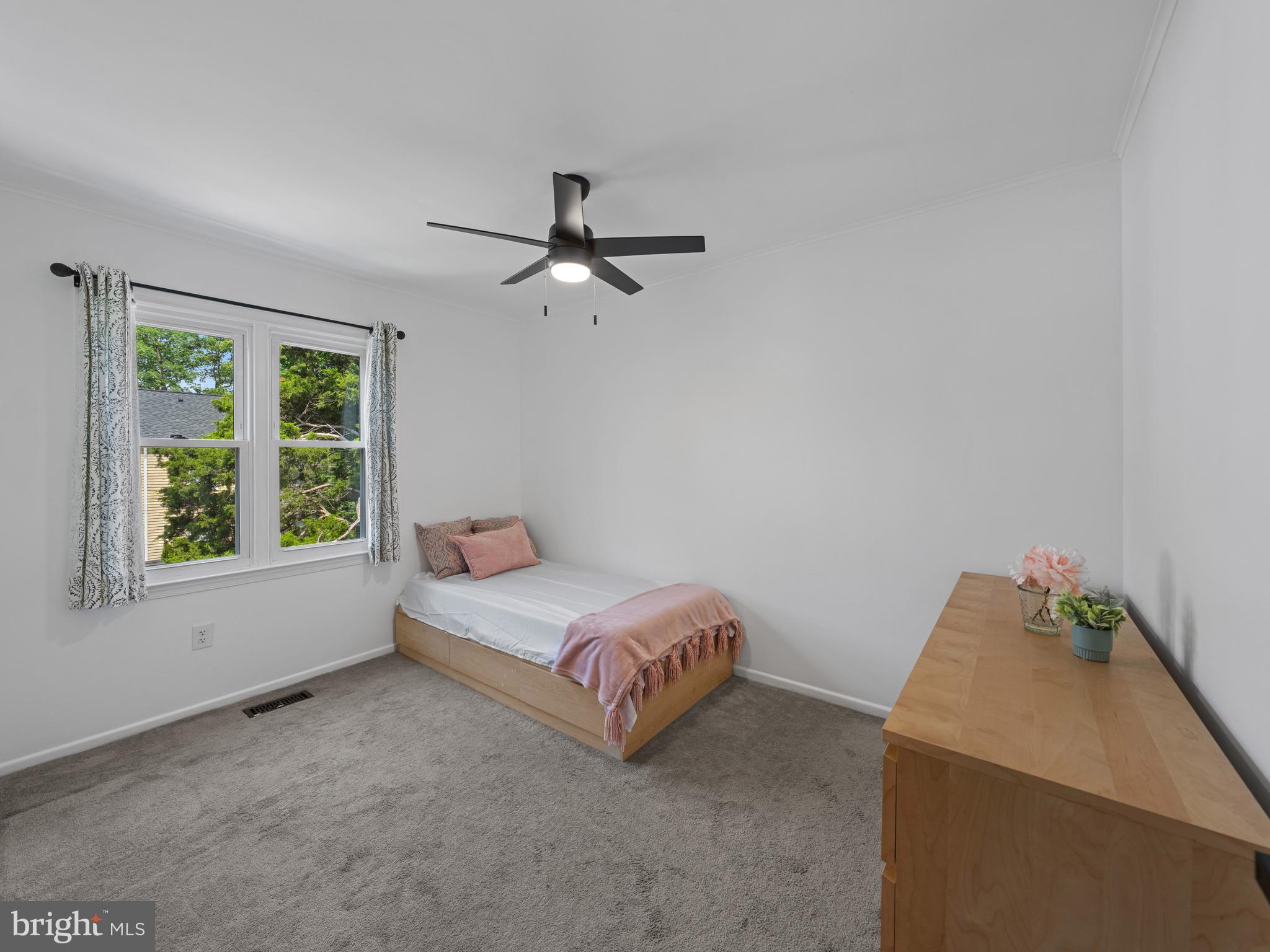 8448 Kitchener Drive Springfield, VA 22153 - Photo 17 of 32 a room with a bed and a window