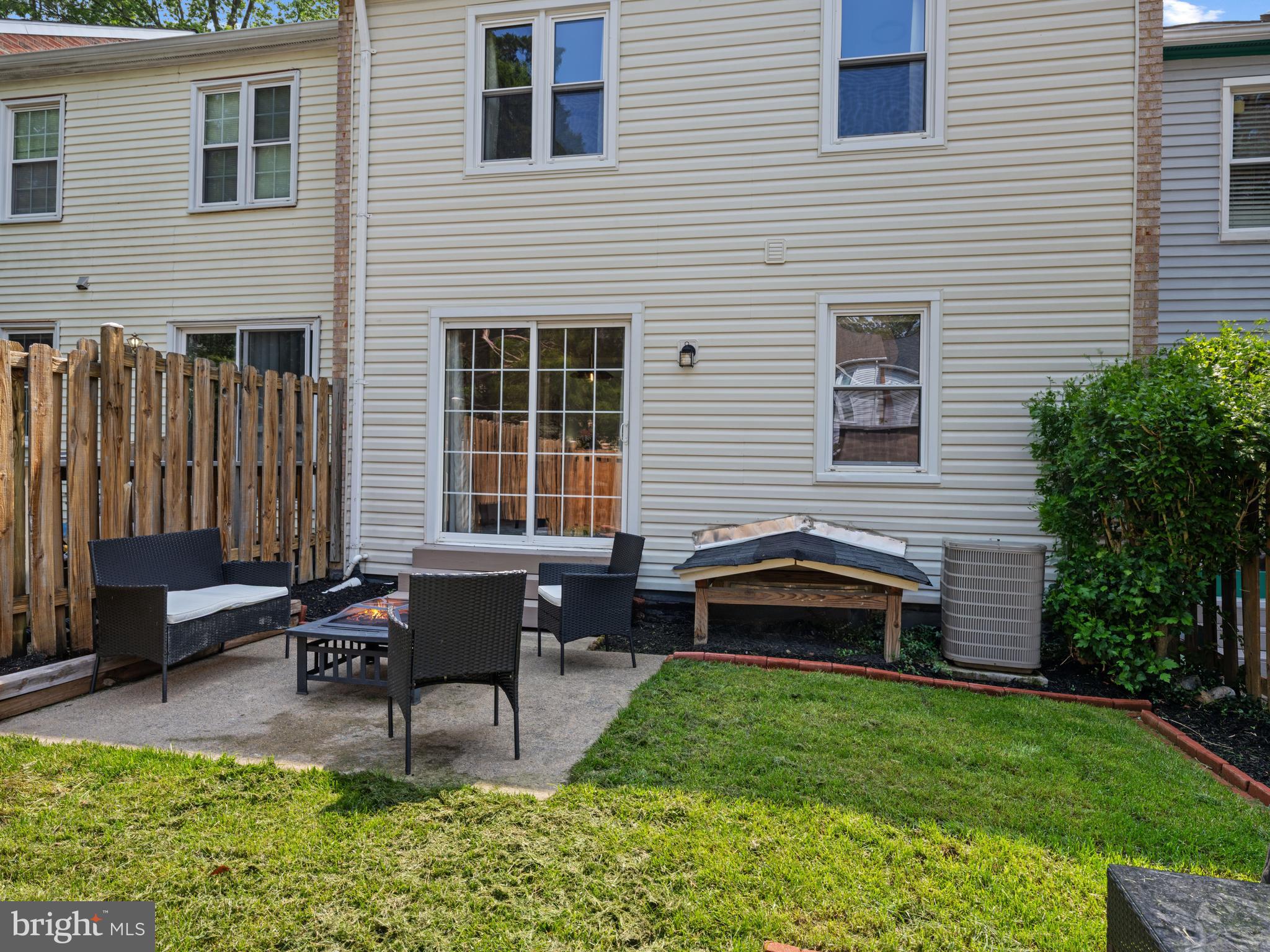 8448 Kitchener Drive Springfield, VA 22153 - Photo 29 of 32 a backyard of a house with outdoor seating