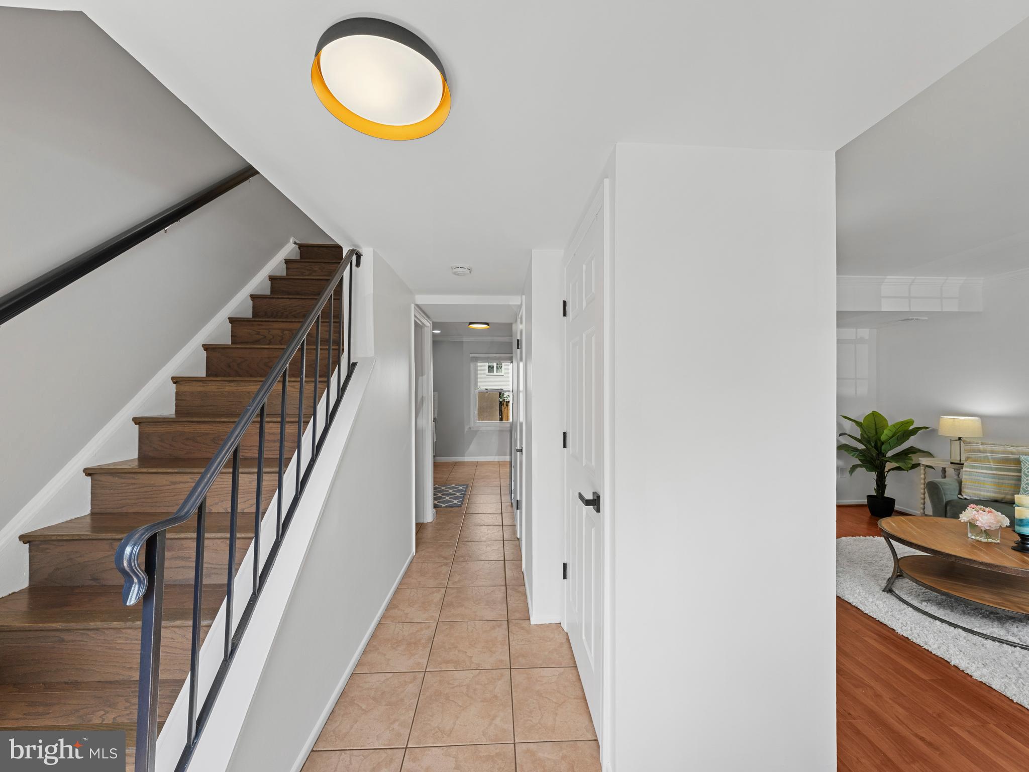 8448 Kitchener Drive Springfield, VA 22153 - Photo 3 of 32 a view of a hallway with wooden floor and entryway