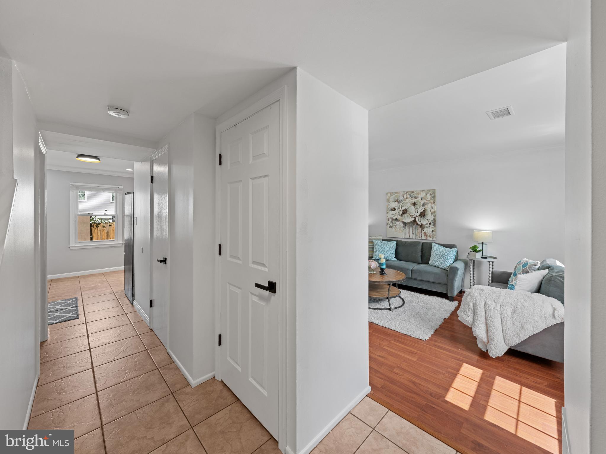 8448 Kitchener Drive Springfield, VA 22153 - Photo 4 of 32 a living room with furniture and a table