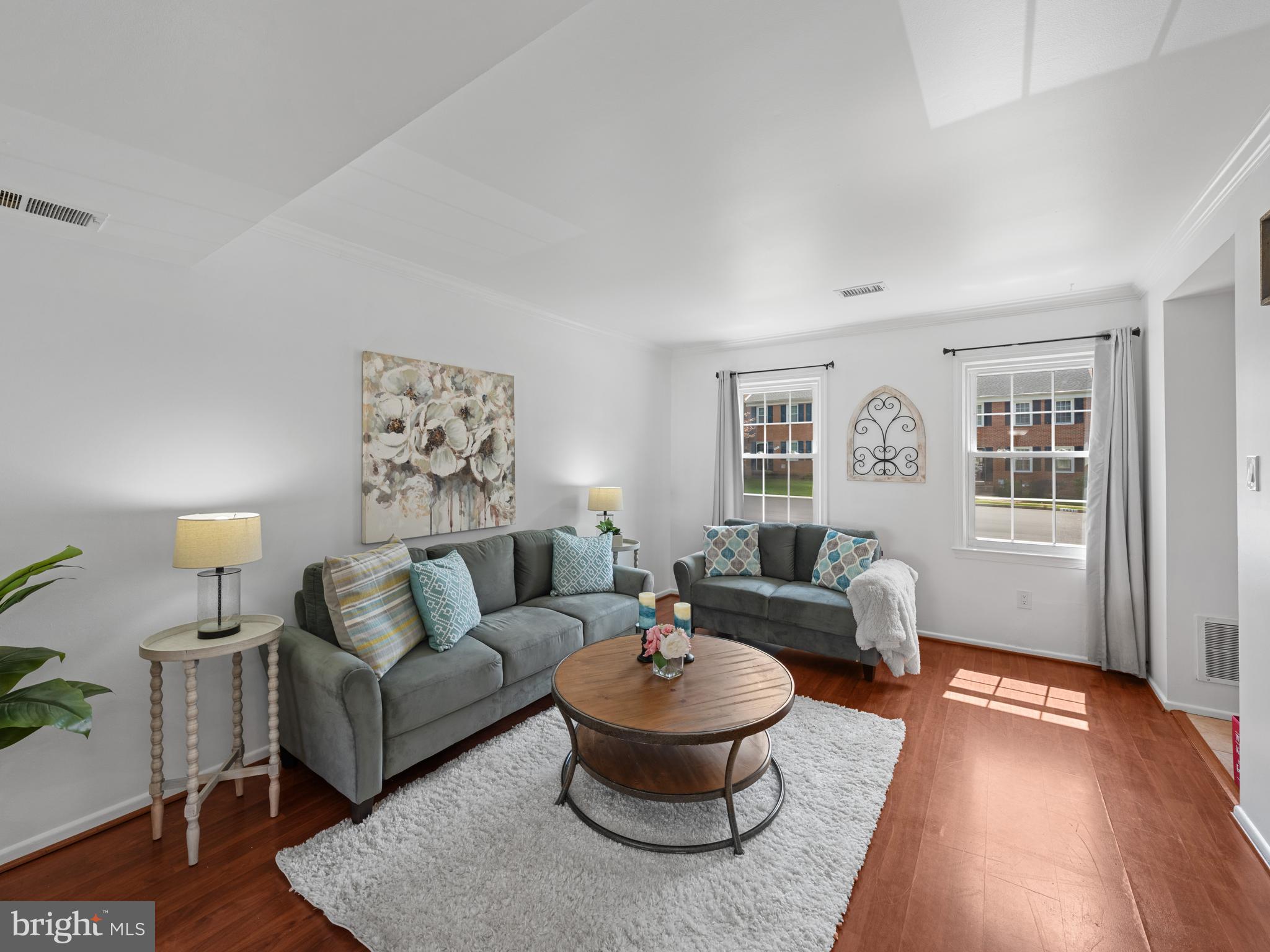 8448 Kitchener Drive Springfield, VA 22153 - Photo 7 of 32 a living room with furniture and a wooden floor