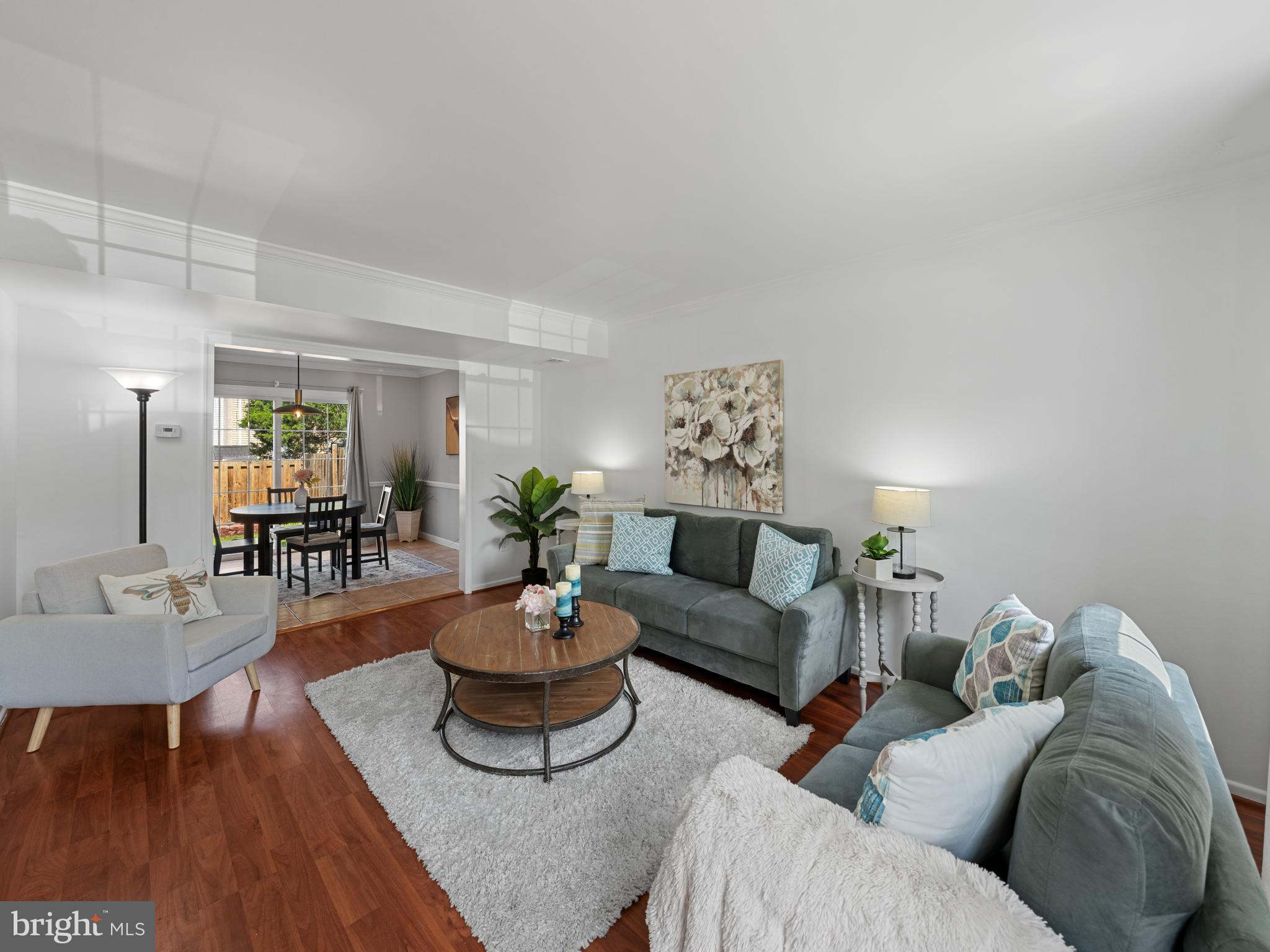8448 Kitchener Drive Springfield, VA 22153 - Photo 9 of 32 a living room with furniture and wooden floor