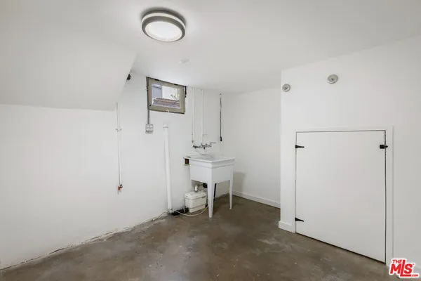 a view of a room with table and chairs