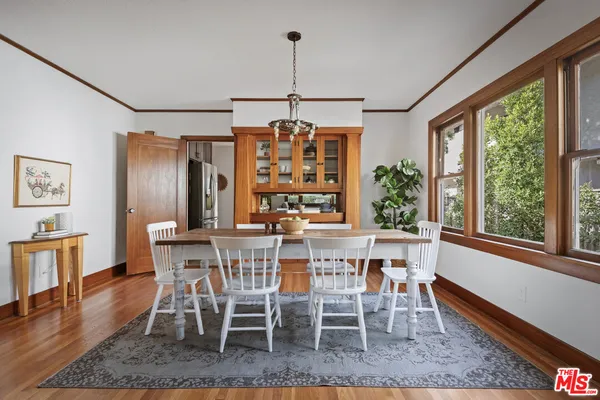 a dining room with furniture window wooden floor