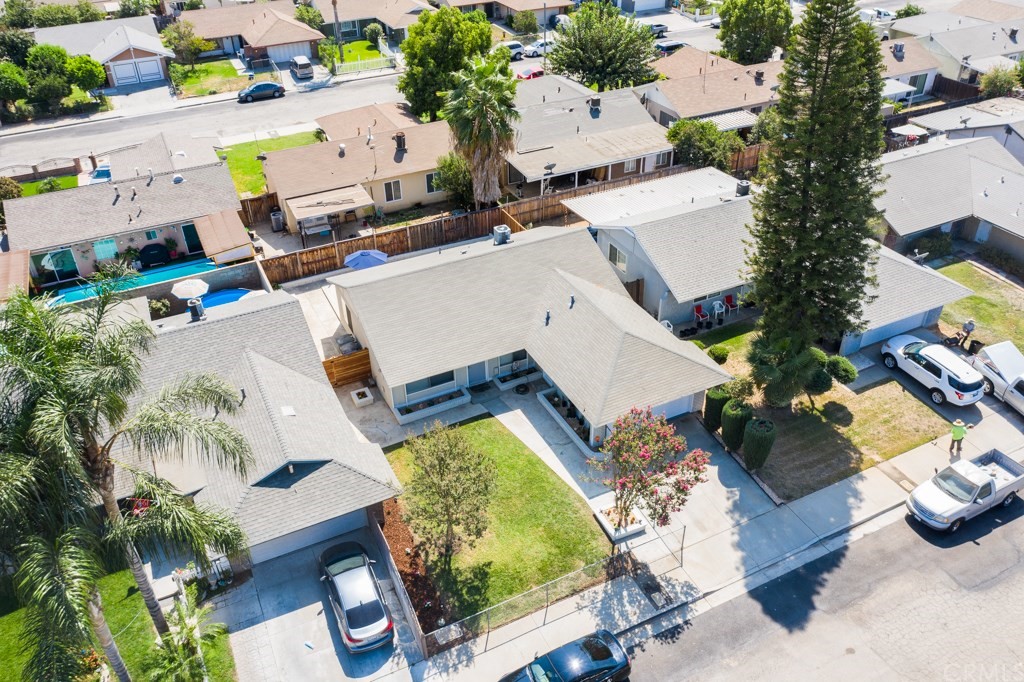7920 Temecula Place Riverside, CA 92503 - Photo 30 of 34 an aerial view of a house with a swimming pool and lawn chairs