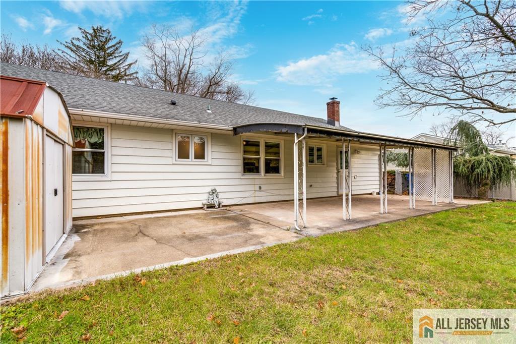 1474 Huron Road North Brunswick, NJ 08902 - Photo 12 of 16 a view of a house with backyard and a tree