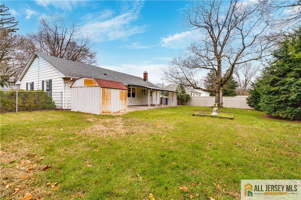1474 Huron Road North Brunswick, NJ 08902 - Photo 14 of 16 a house view with swimming pool in front of yard