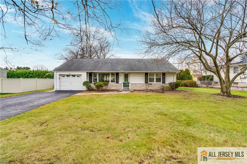 1474 Huron Road North Brunswick, NJ 08902 - Photo 16 of 16 a front view of house with yard and swimming pool