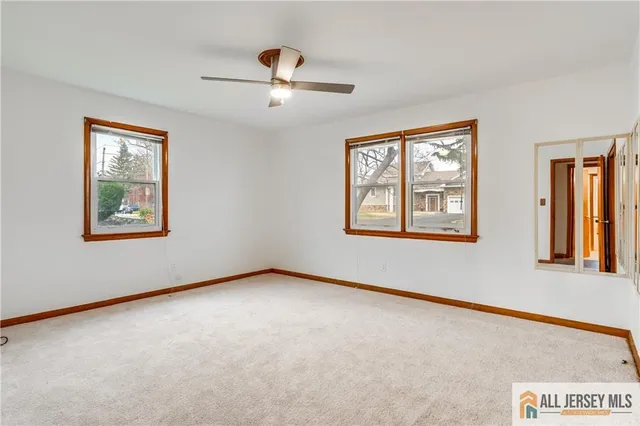 a view of an empty room with windows