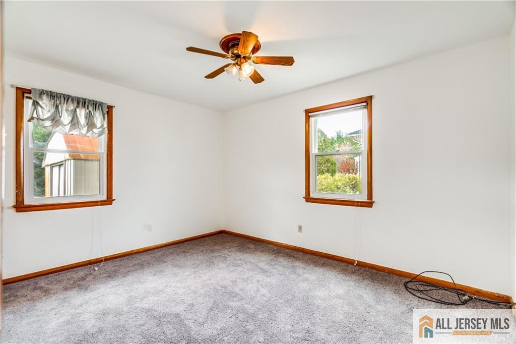 1474 Huron Road North Brunswick, NJ 08902 - Photo 9 of 16 a view of an empty room with a window