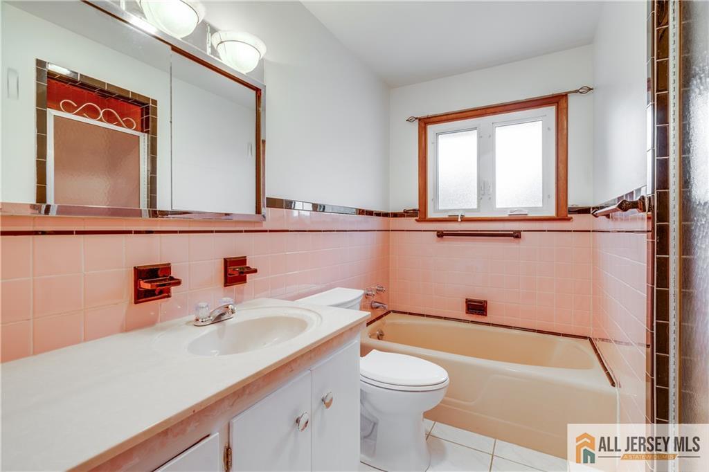 1474 Huron Road North Brunswick, NJ 08902 - Photo 10 of 16 a bathroom with a sink and a mirror